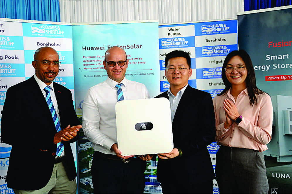 Davis & Shirtliff Technical Director Philip Holi and Supply Director Henry Davis with Huawe officials during the partnership