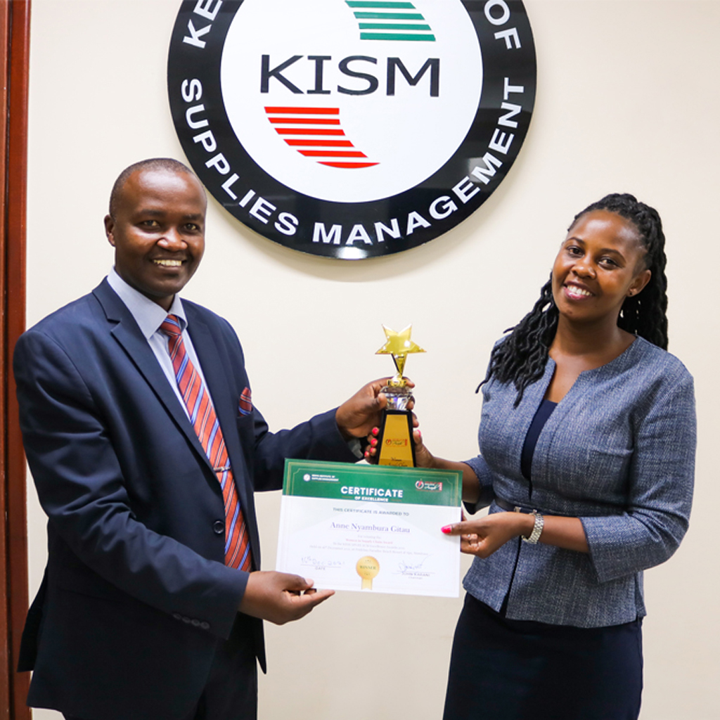 Davis & Shirtliff procurement manager Anne Nyambura receiving award for best woman in supply