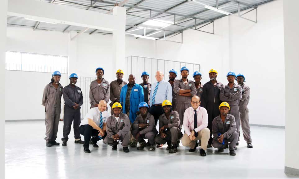 Davis & Shirtliff Chairman is pictured with the Managing Director Edward Davis and Supply Director Henry Davis with staff during completion of a construction in head office